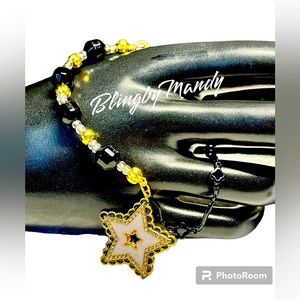 Pretty Swarovski black/gold link chain bracelet with stunning rhinestone star
